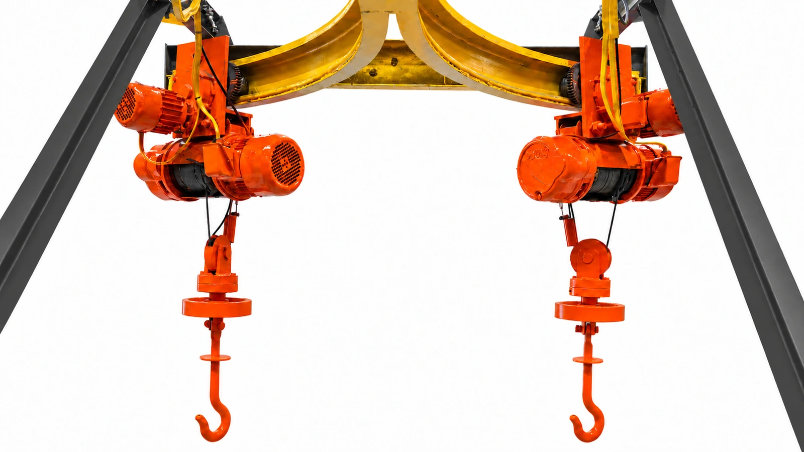 Twin orange hoists and yellow track with MetalPress dark charcoal structural supports
