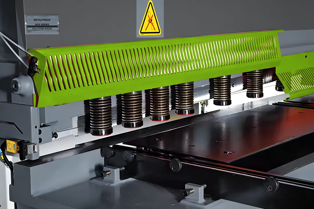 MGS green finger guard and hydraulic hold-downs, dark grey fascia and MetalPress identification plate